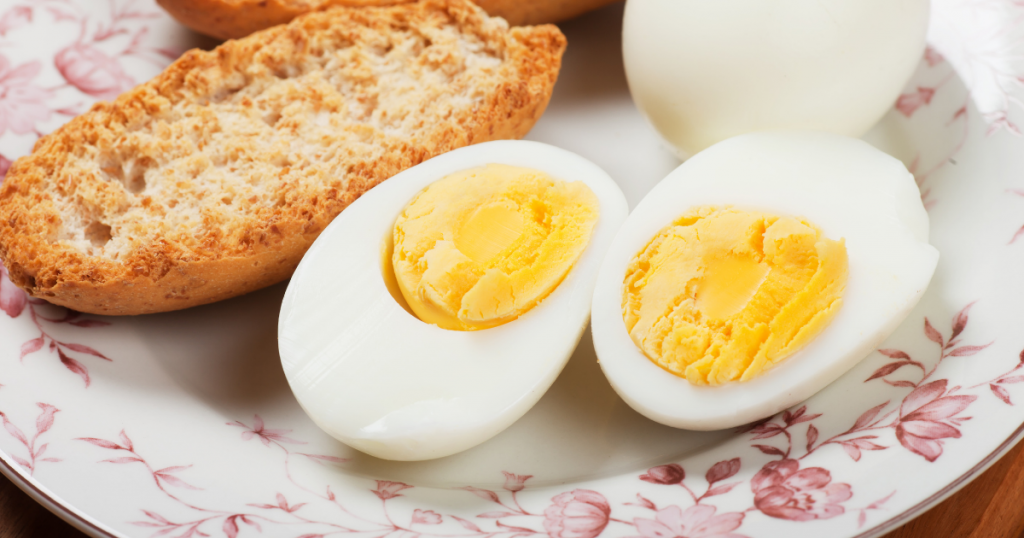 Sliced boiled eggs with toast.