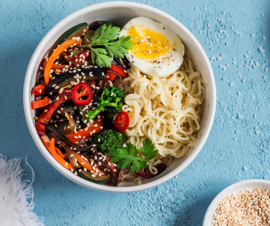 Boiled Egg in a bowl of ramen noodles and vegetables