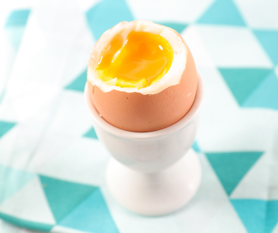 Soft Boiled Egg in a brown shell in an egg cup. 