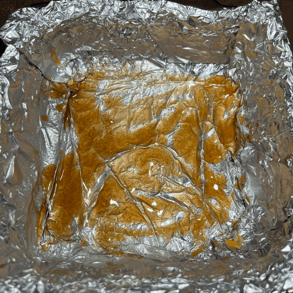 Sauce in the bottom of the foil pan for enchiladas. 