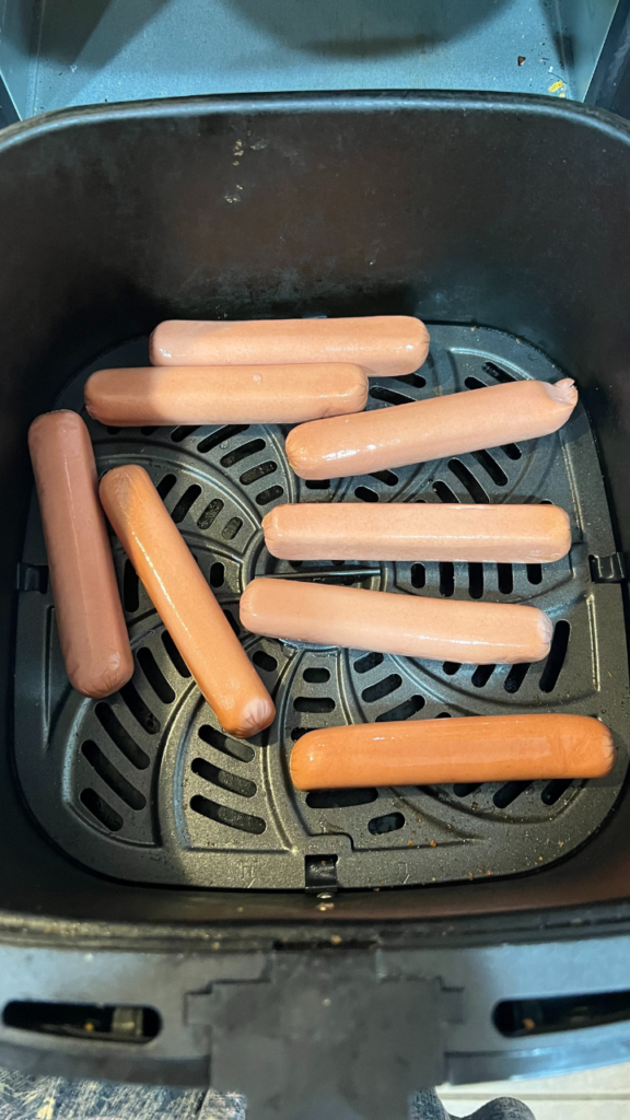 Hot Dogs placed in the Air Fryer ready to heat. 