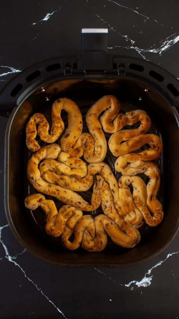 Cinnamon Rolls freshly cooked in the air fryer basket