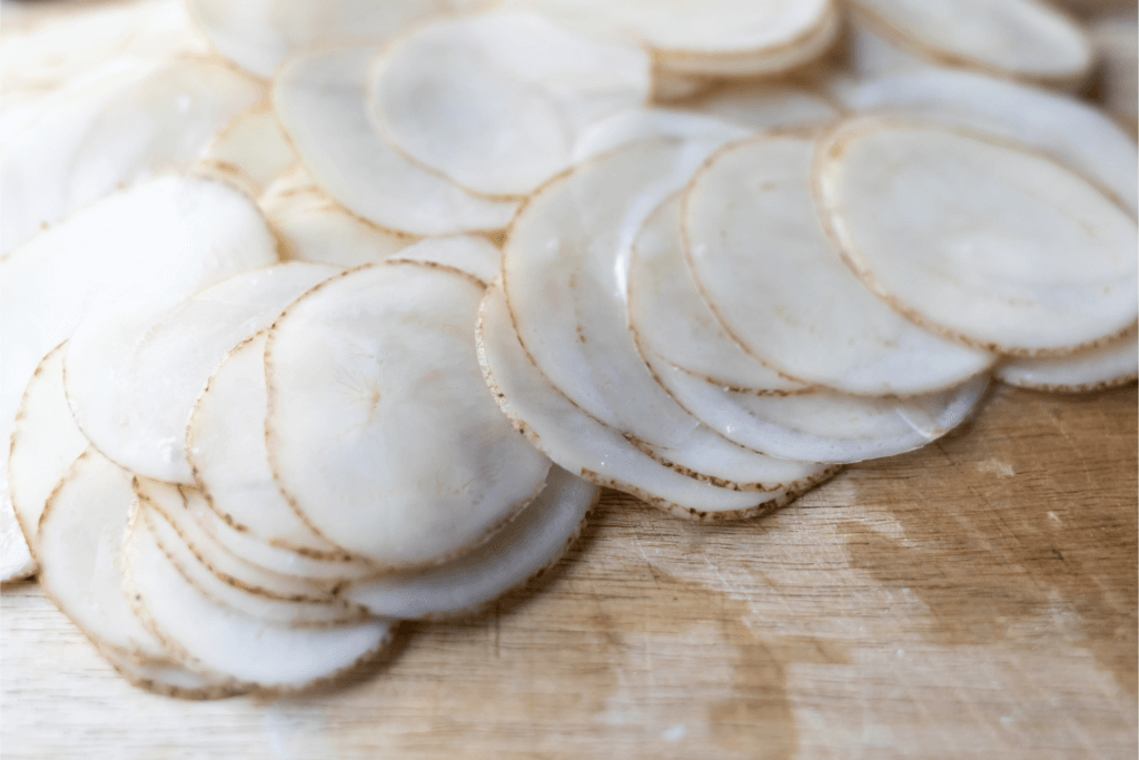 Slices of potato on a cutting board